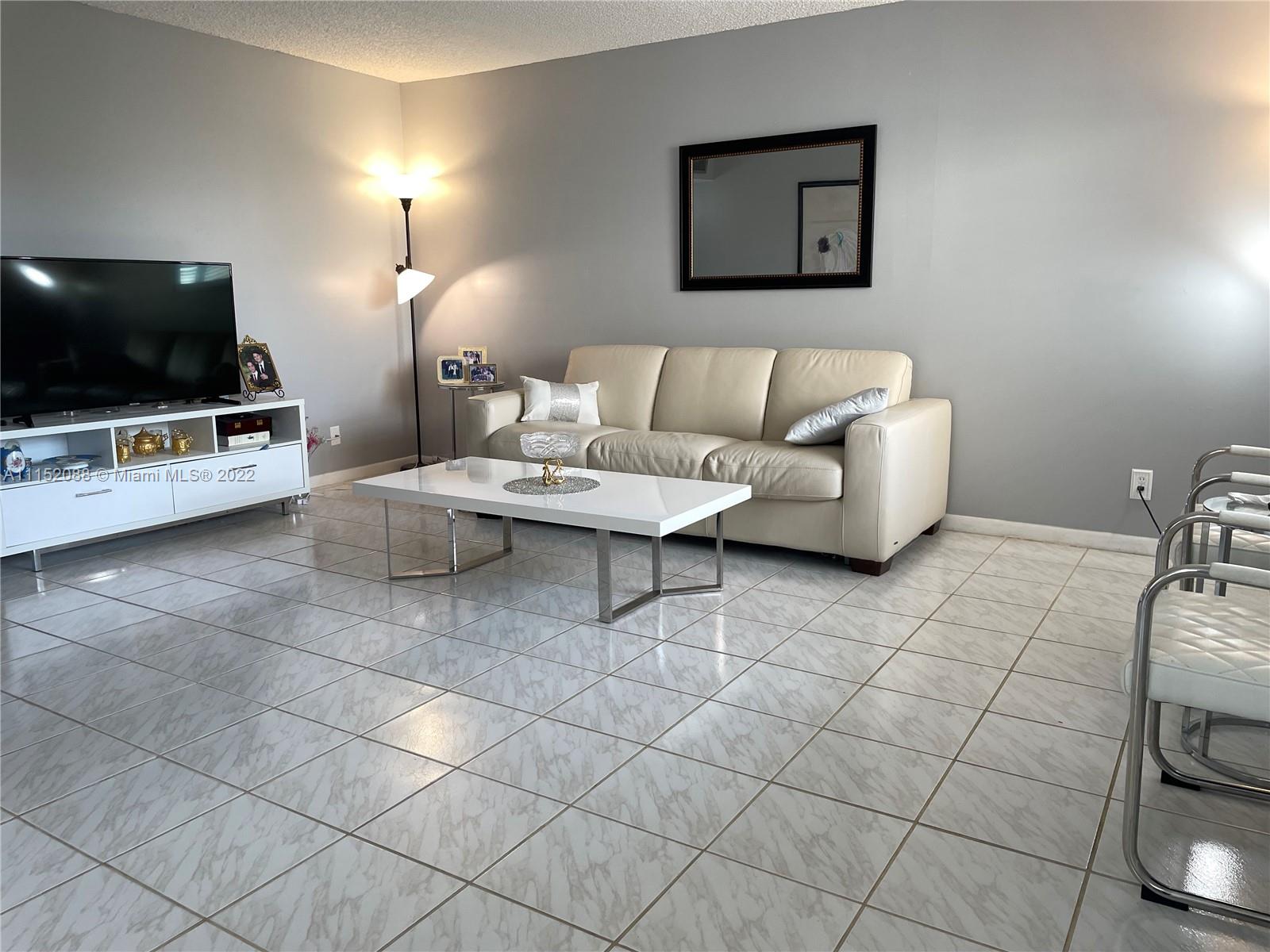 Kings Point Delray Beach, FL 33484 - Photo 14 of 69 a living room with furniture and a flat screen tv