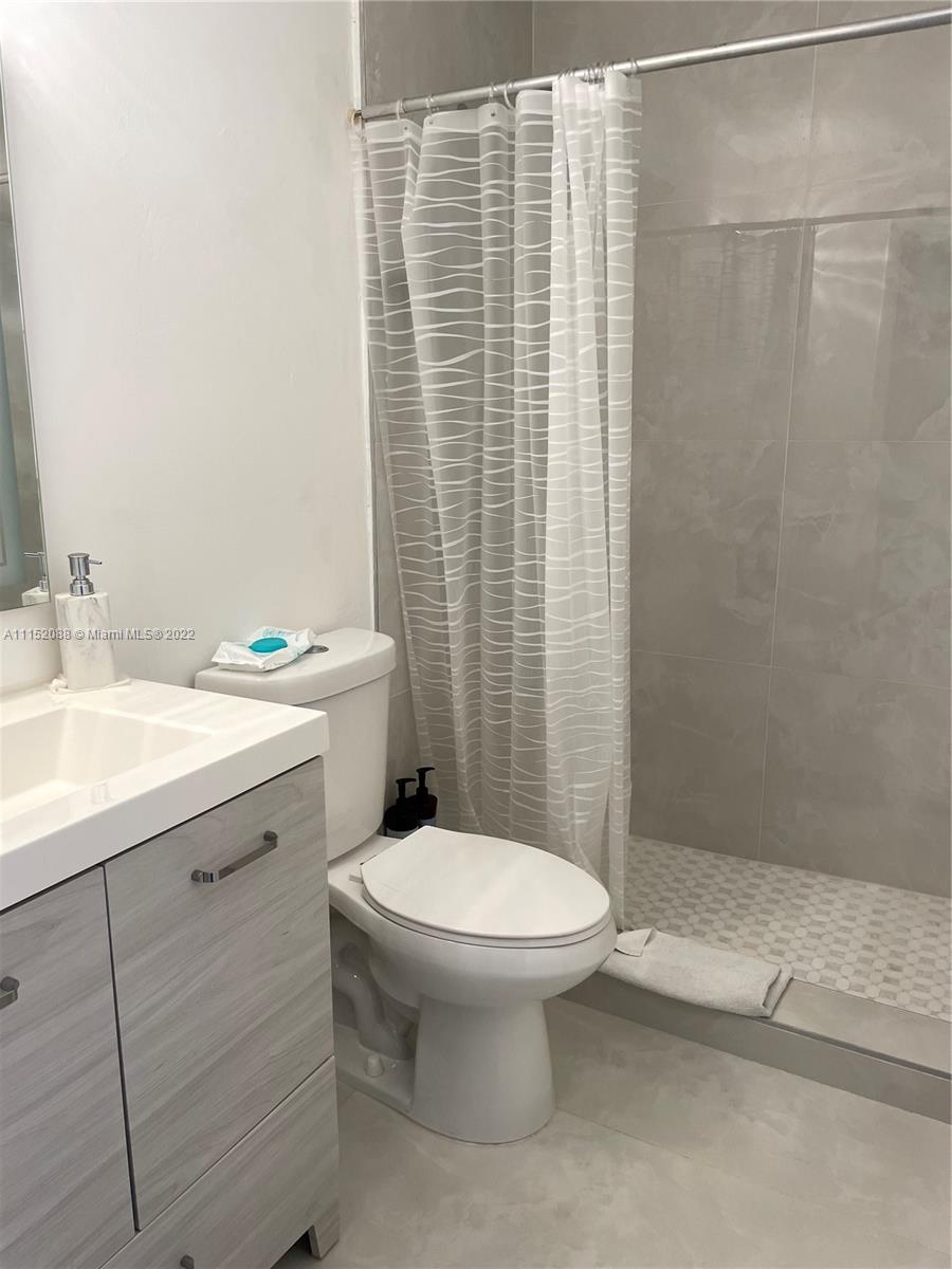 Kings Point Delray Beach, FL 33484 - Photo 30 of 69 a bathroom with a sink a toilet and shower