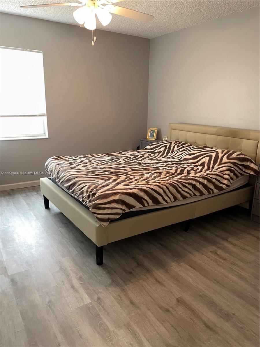 Kings Point Delray Beach, FL 33484 - Photo 36 of 69 a bed sitting in a bedroom next to a window