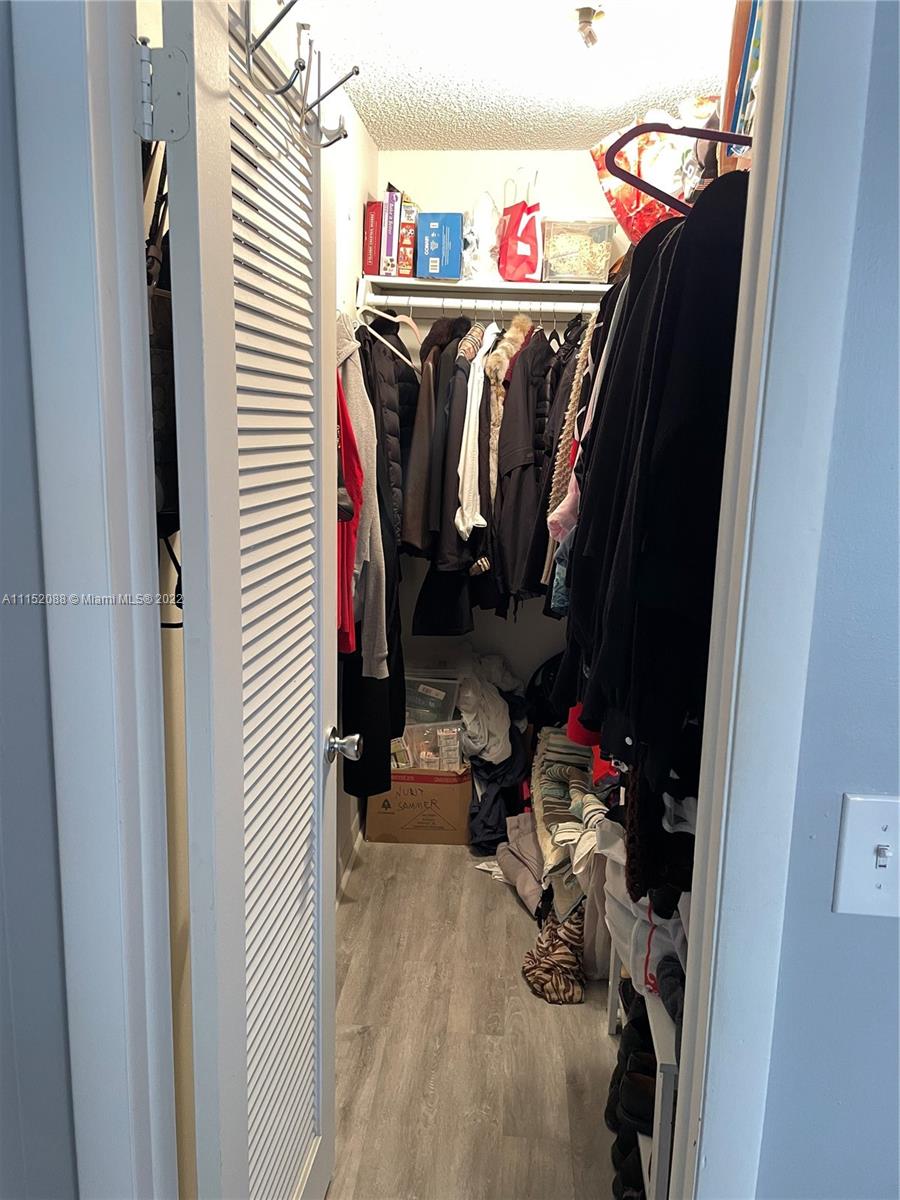 Kings Point Delray Beach, FL 33484 - Photo 37 of 69 a view of walk in closet with clothes and shoes