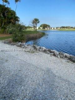 Kings Point Delray Beach, FL 33484 - Photo 42 of 69 a view of a lake with a mountain in the background