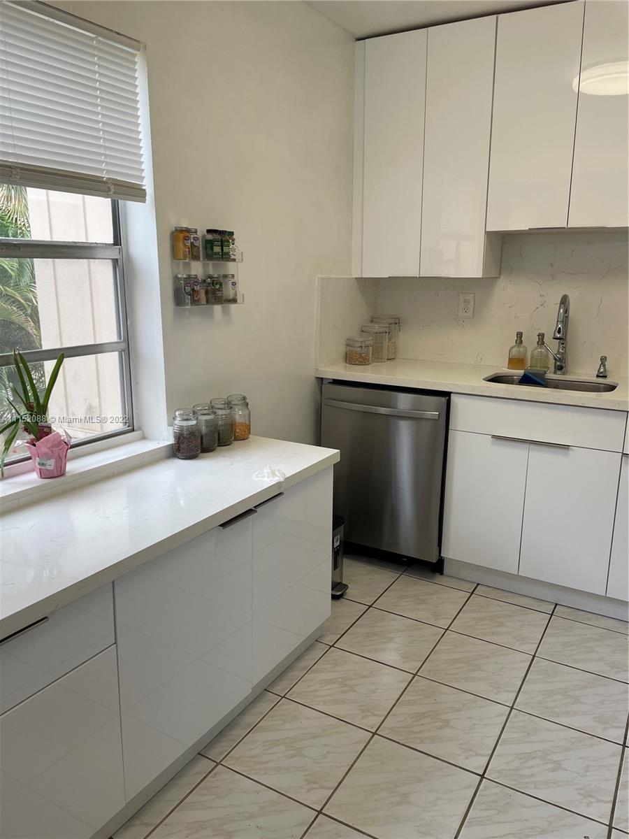 Kings Point Delray Beach, FL 33484 - Photo 47 of 69 a kitchen with a sink cabinets and window