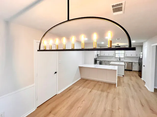 a view of living room with wooden floor