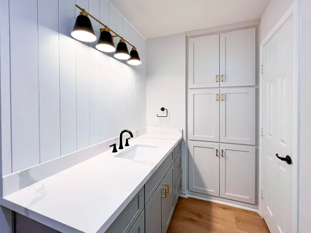 a bathroom with a sink and a mirror