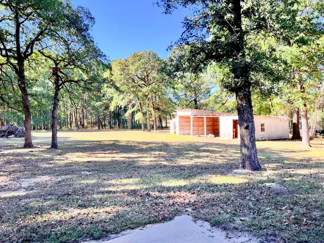 a view of a house with a tree