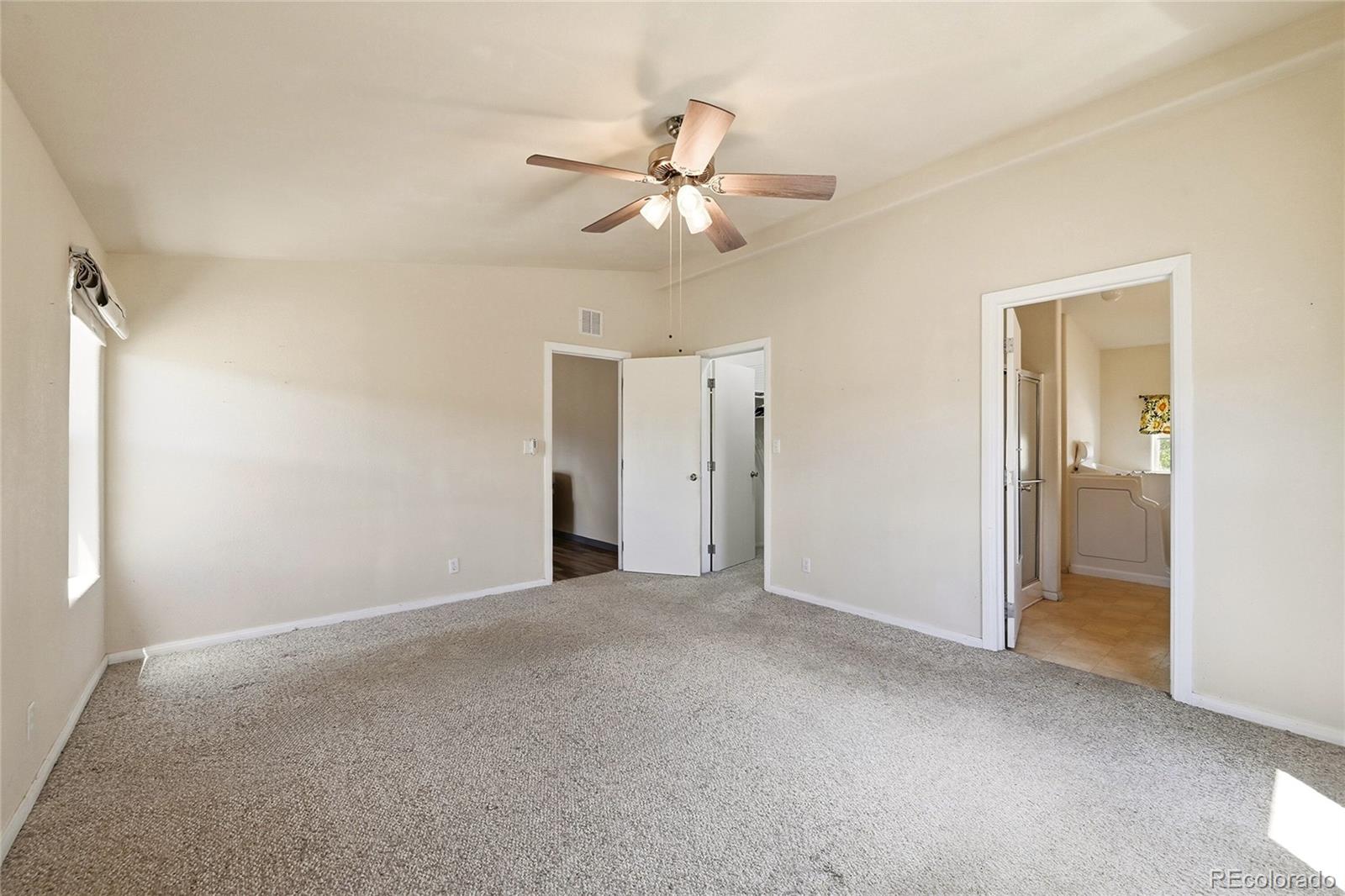 20300 Old Ranch Loop Nathrop, CO 81236 - Photo 16 of 35 a view of an empty room and a ceiling fan