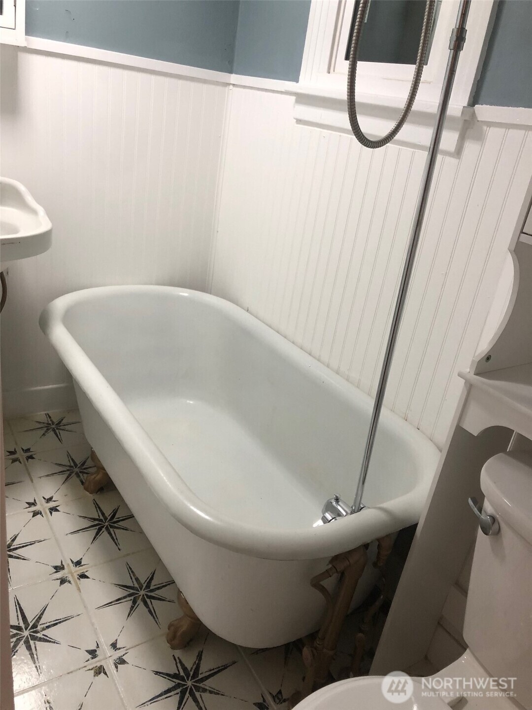 5703 North Wall Street Spokane, WA 99205 - Photo 11 of 23 a white toilet sitting next to a shower