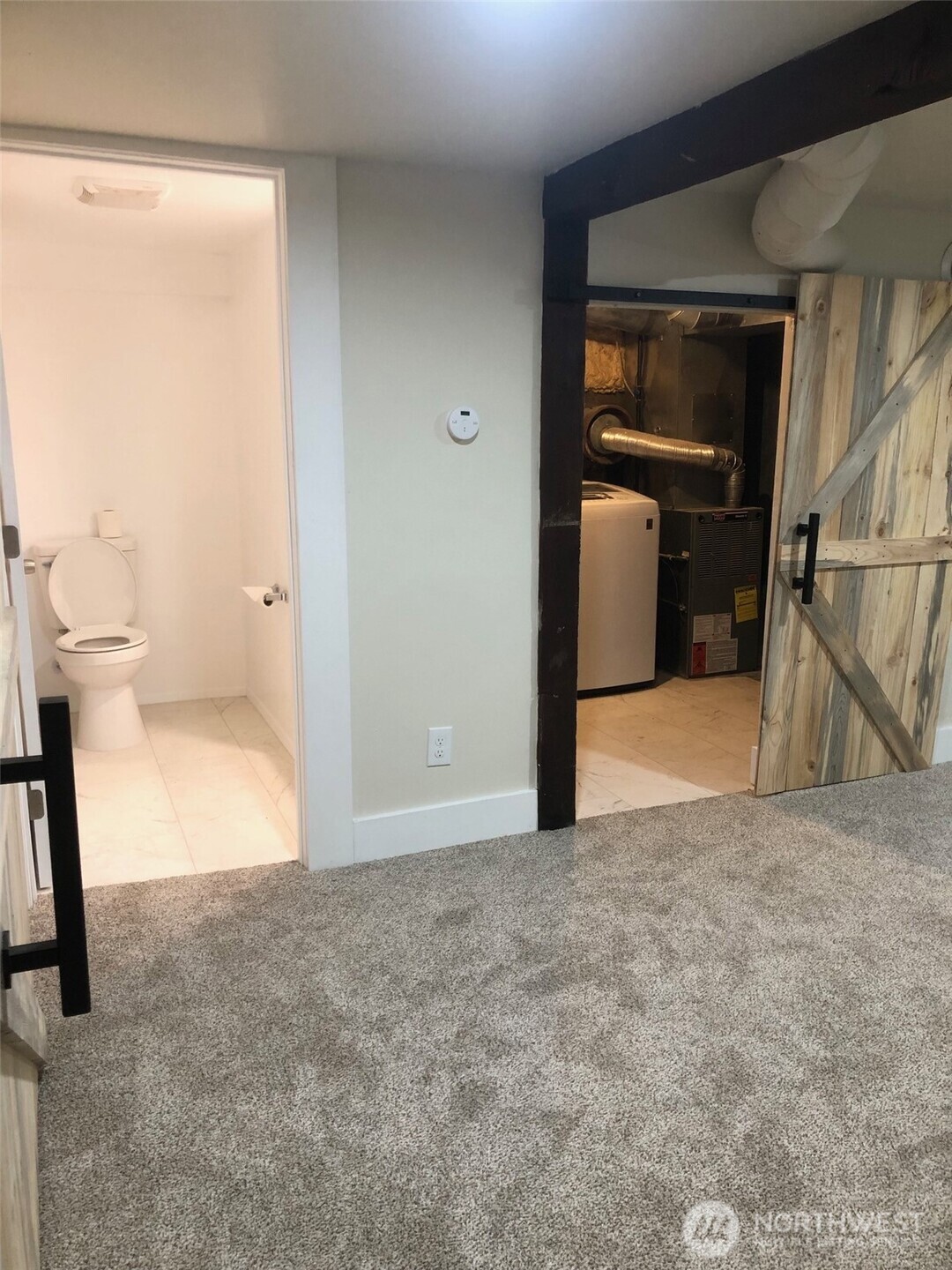 5703 North Wall Street Spokane, WA 99205 - Photo 14 of 23 a view of a big room with closet and wooden floor