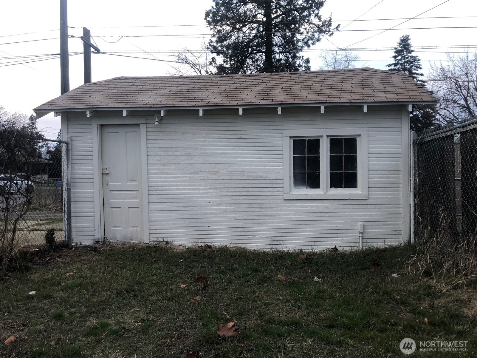 5703 North Wall Street Spokane, WA 99205 - Photo 20 of 23 a side view of a house with a yard