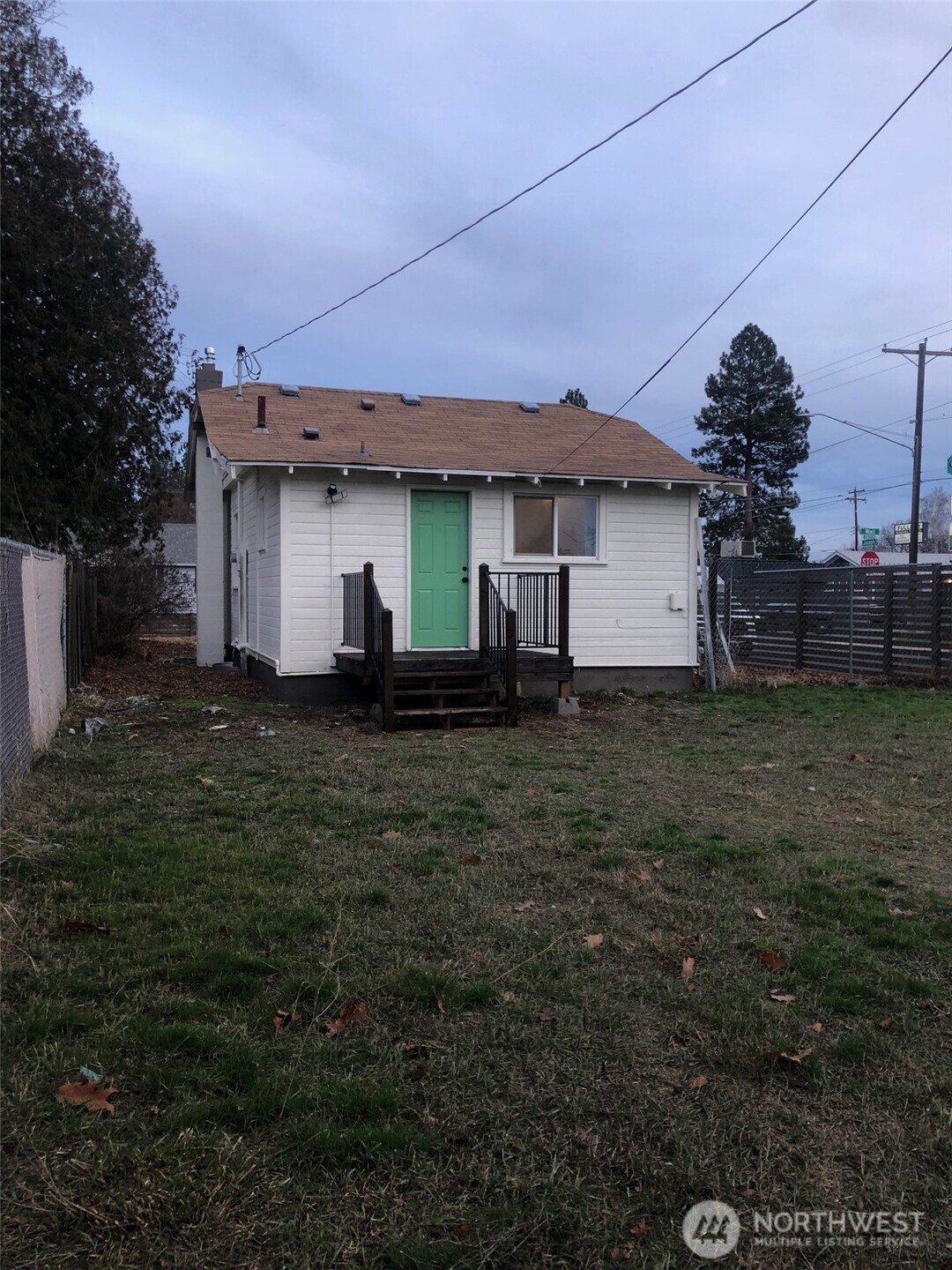 5703 North Wall Street Spokane, WA 99205 - Photo 22 of 23 a front view of a house with a yard