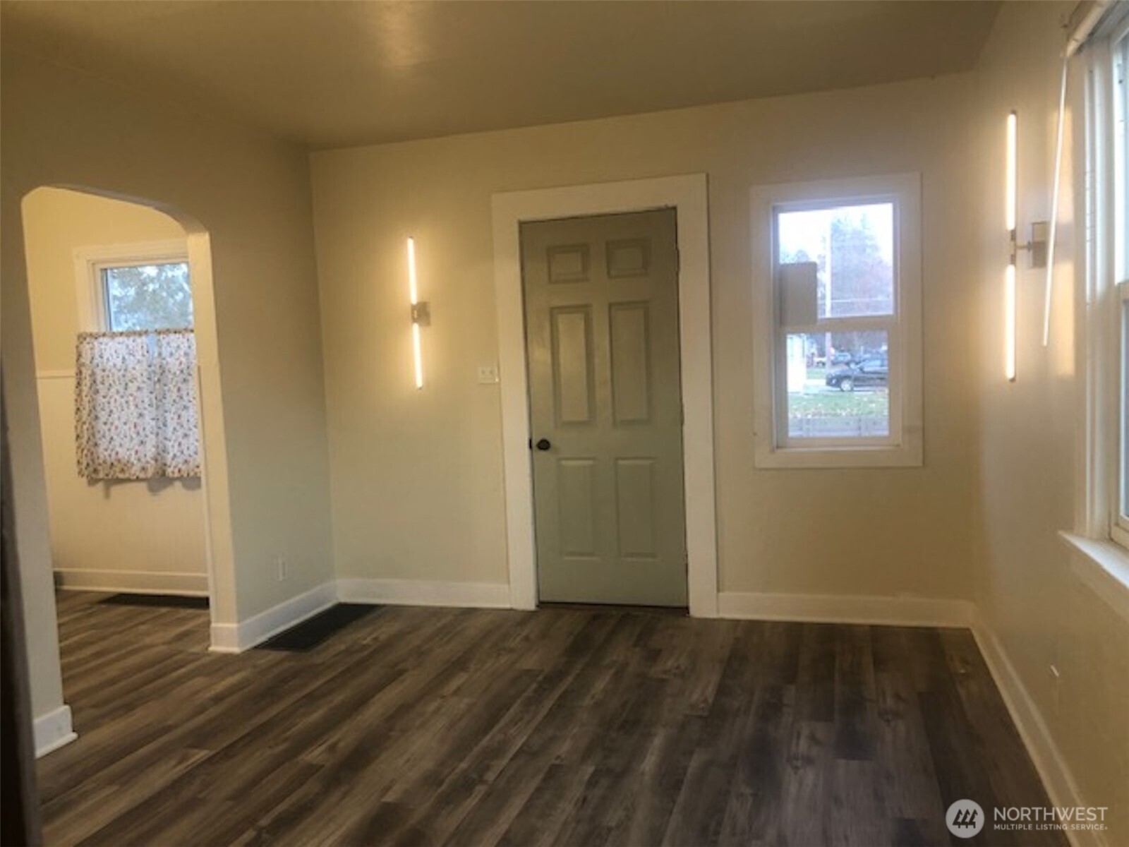5703 North Wall Street Spokane, WA 99205 - Photo 5 of 23 an empty room with wooden floor and windows