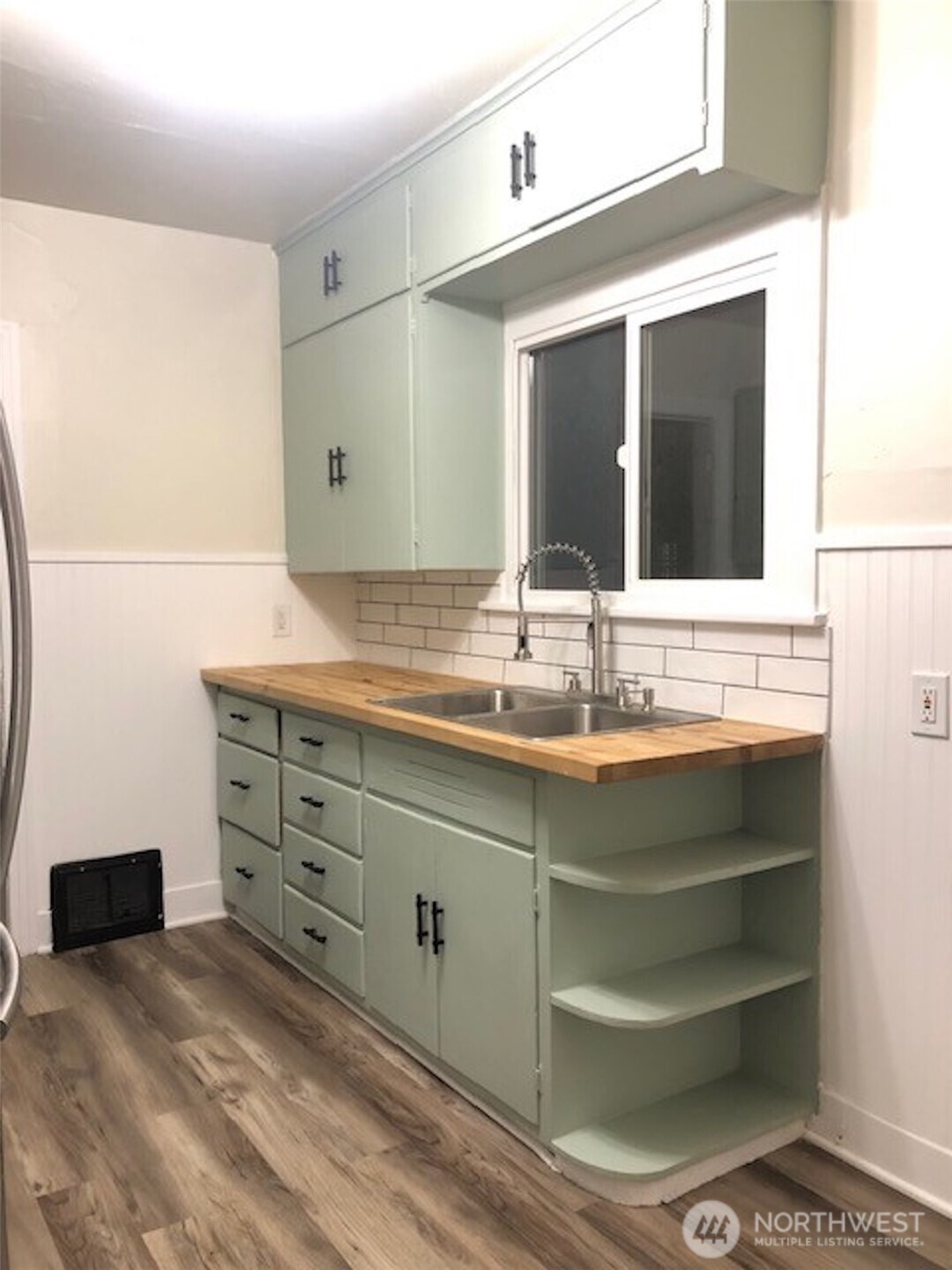 5703 North Wall Street Spokane, WA 99205 - Photo 6 of 23 a bathroom with a sink and a mirror