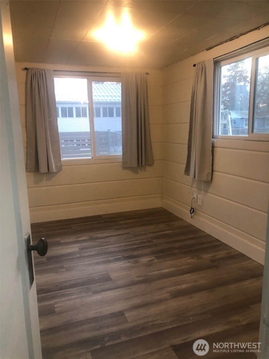 5703 North Wall Street Spokane, WA 99205 - Photo 9 of 23 a view of empty room with wooden floor and fan