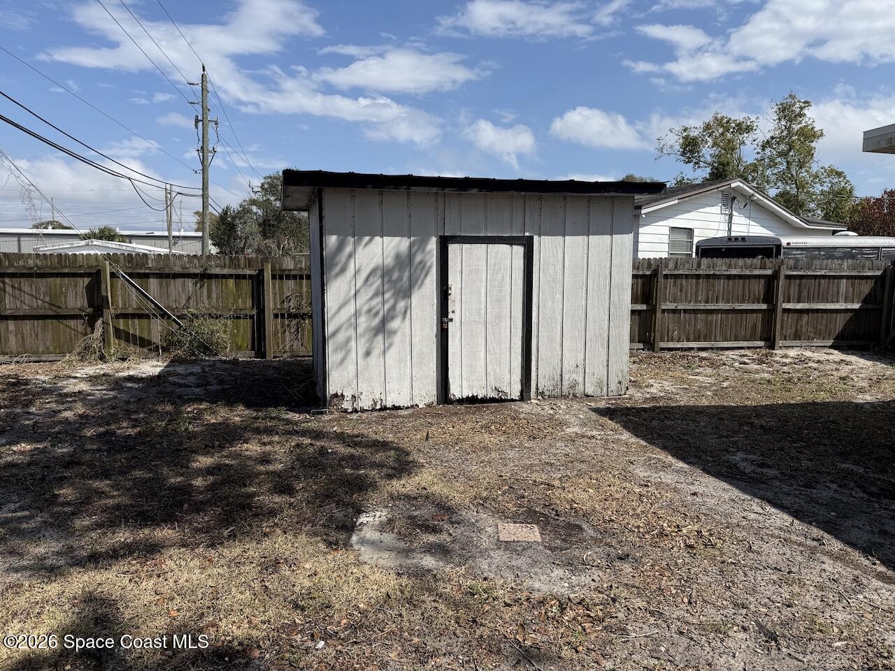 1666 Terrace Street Cocoa, FL 32922 - Photo 11 of 12 a front view of a house with a yard and garage