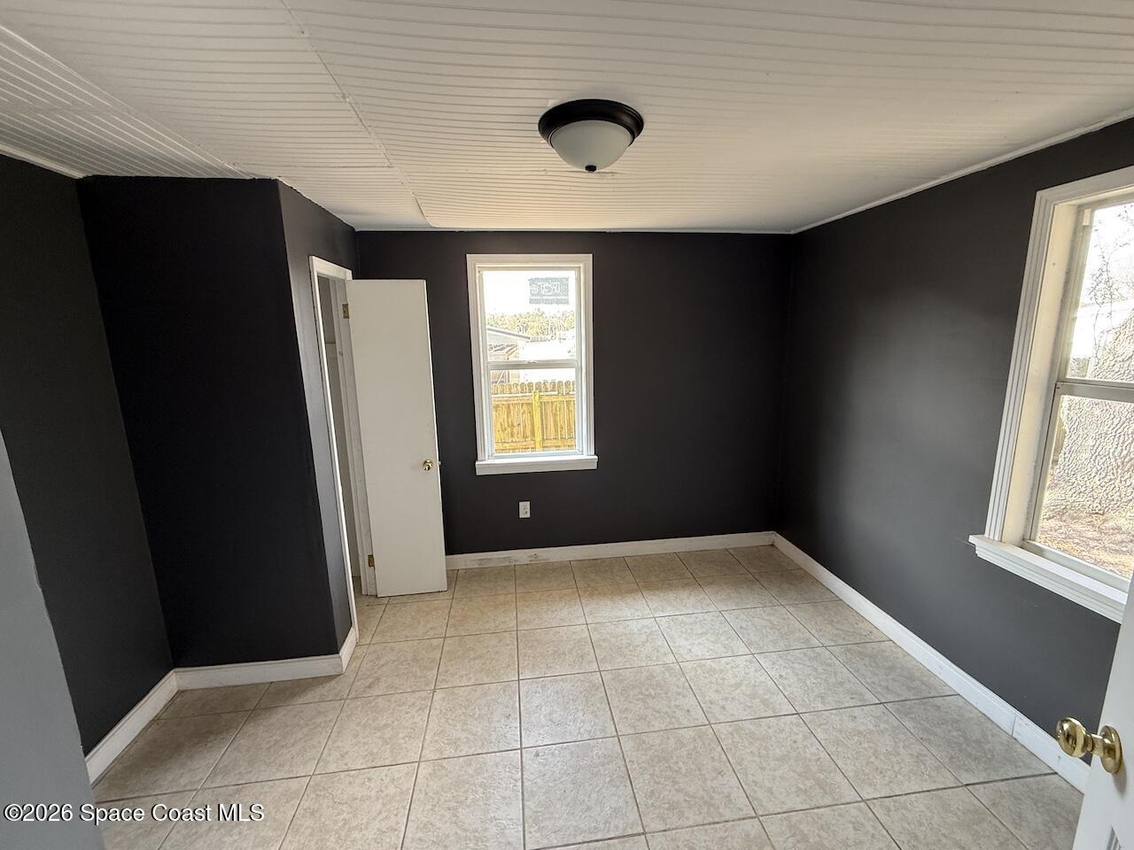 1666 Terrace Street Cocoa, FL 32922 - Photo 6 of 12 a view of an empty room with a window