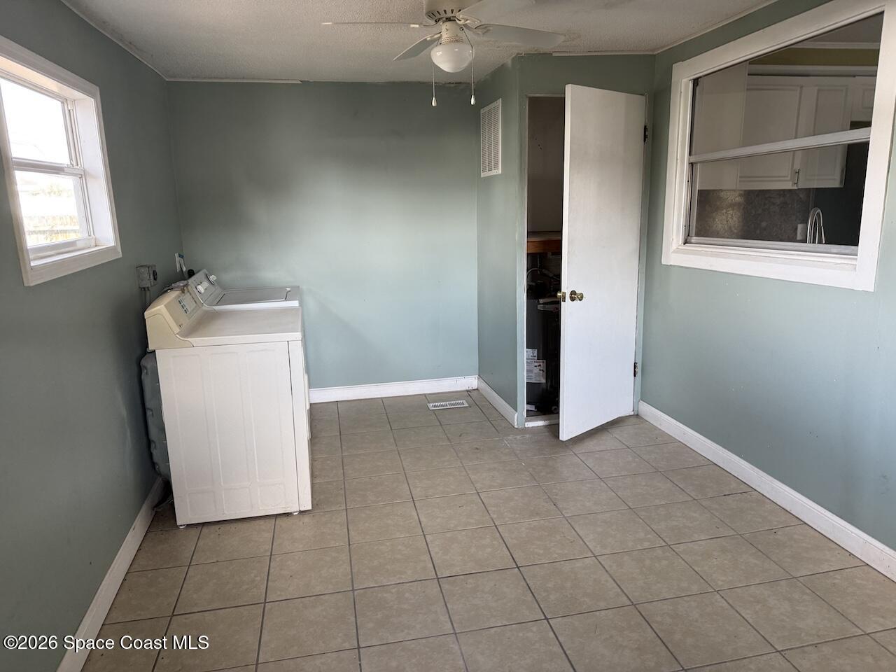1666 Terrace Street Cocoa, FL 32922 - Photo 9 of 12 an entryway with a cabinet and a window