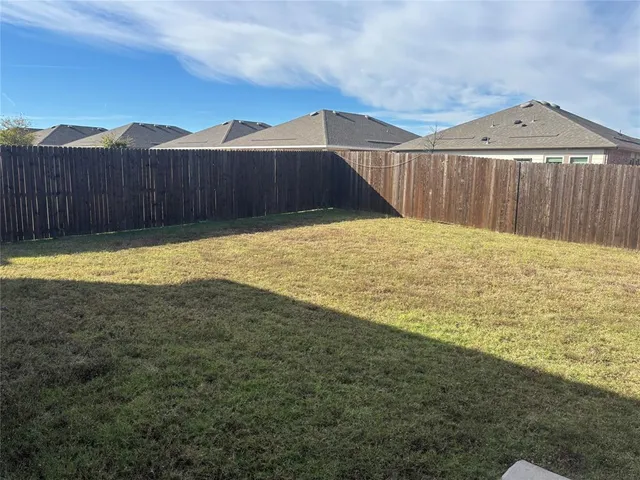 a swimming pool with wooden fence