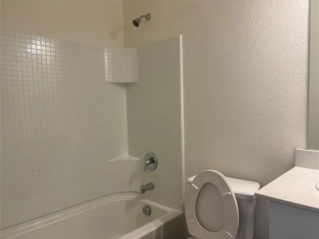 a bathroom with a toilet and a sink