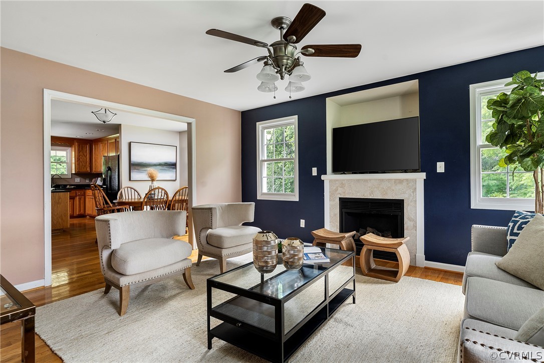 13514 Old Stage Road Hopewell, VA 23860 - Photo 11 of 42 a living room with furniture a fireplace and a flat screen tv