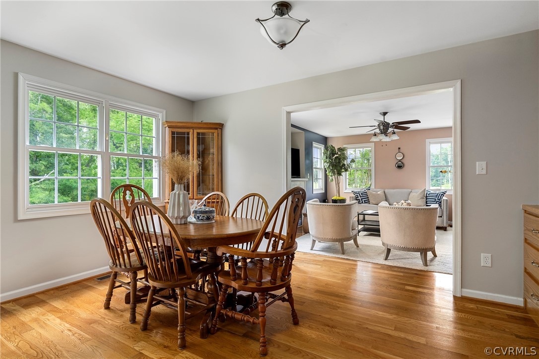 13514 Old Stage Road Hopewell, VA 23860 - Photo 12 of 42 a view of a dining room with furniture window and wooden floor