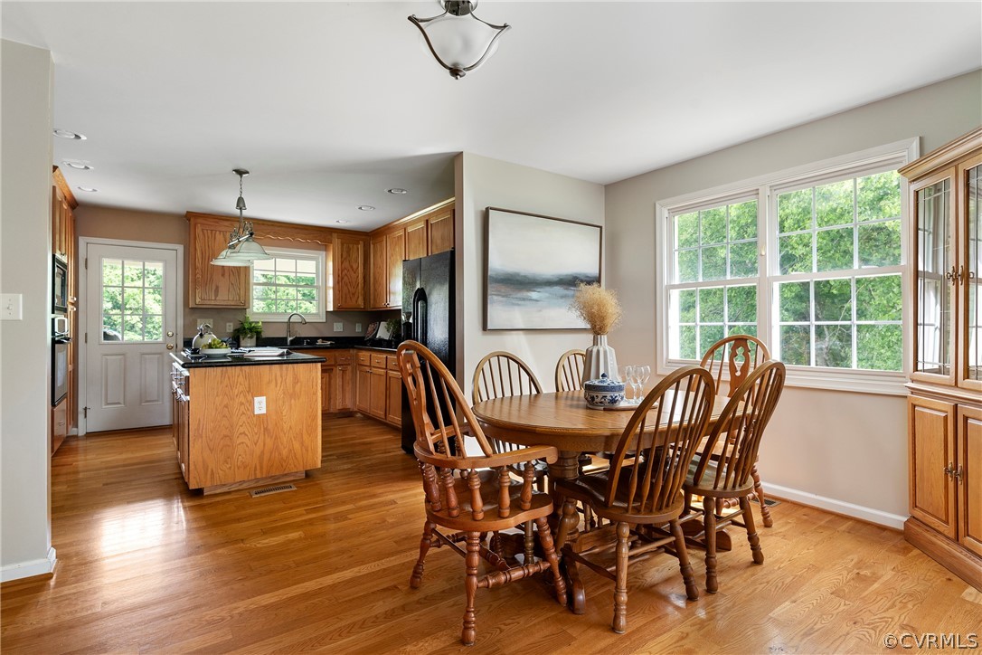 13514 Old Stage Road Hopewell, VA 23860 - Photo 15 of 42 a view of a dining room with furniture and wooden floor