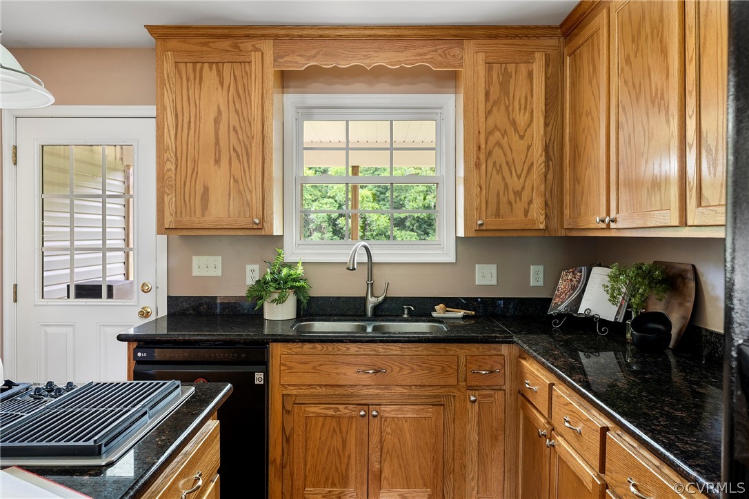 13514 Old Stage Road Hopewell, VA 23860 - Photo 20 of 42 a kitchen with a sink a window and cabinets