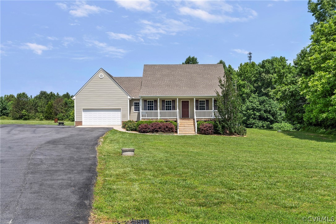 13514 Old Stage Road Hopewell, VA 23860 - Photo 2 of 42 front view of a house with a yard