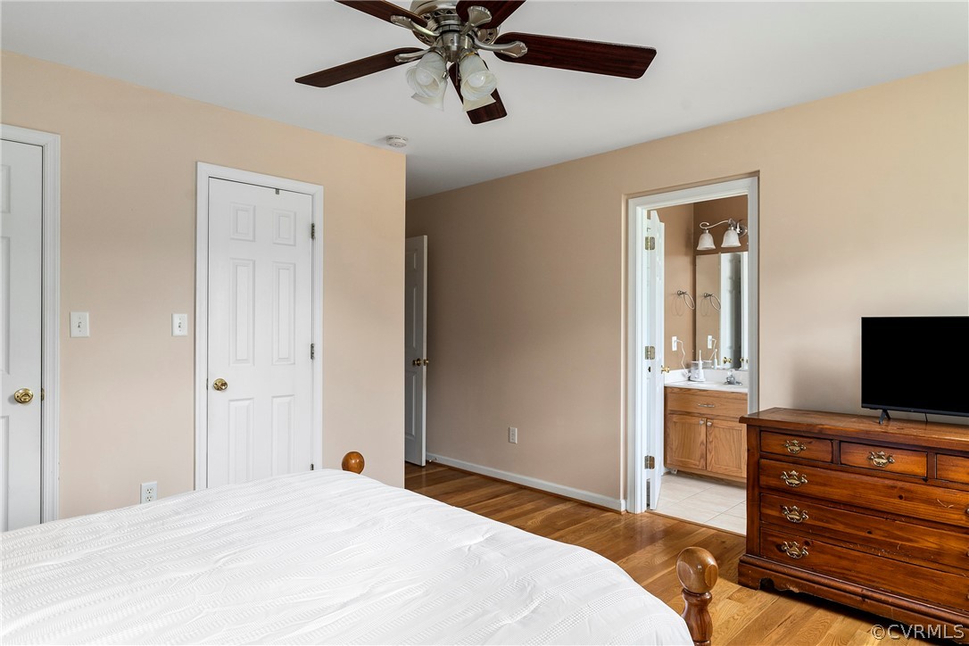13514 Old Stage Road Hopewell, VA 23860 - Photo 22 of 42 a bedroom with a bed and a flat screen tv