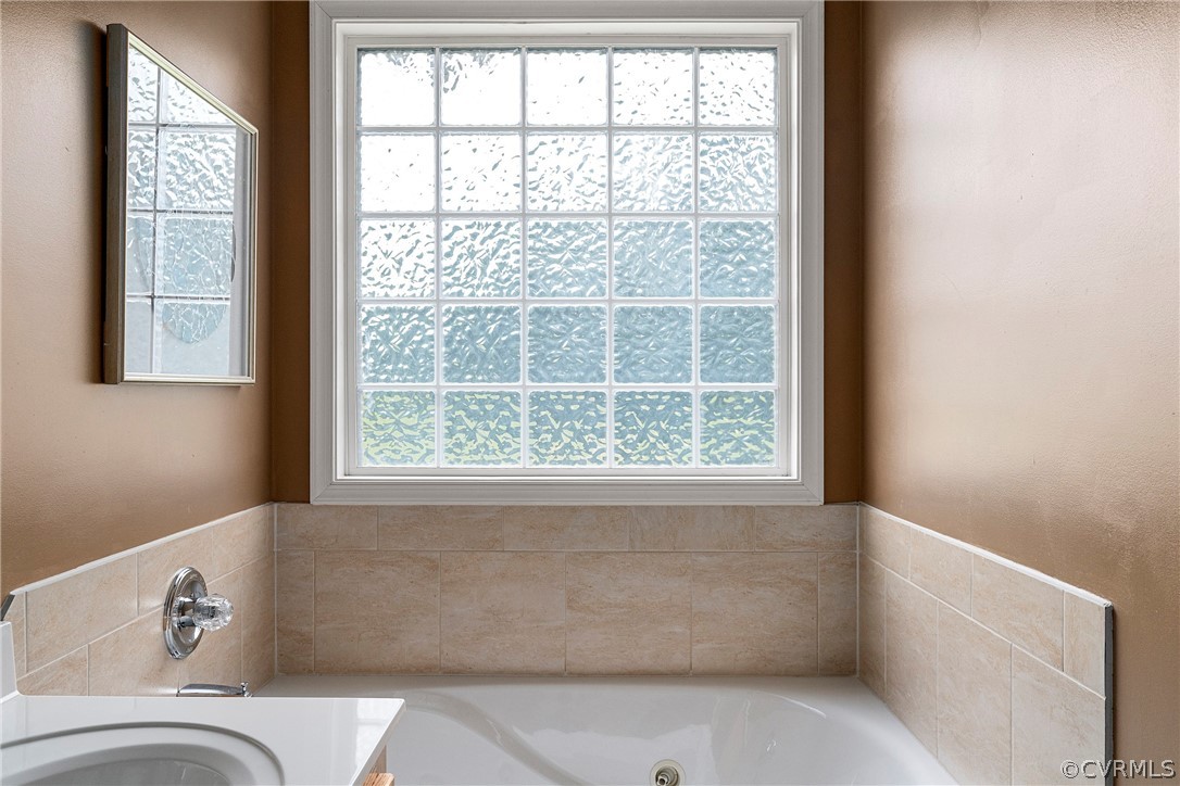13514 Old Stage Road Hopewell, VA 23860 - Photo 24 of 42 a bathroom with a bathtub and window
