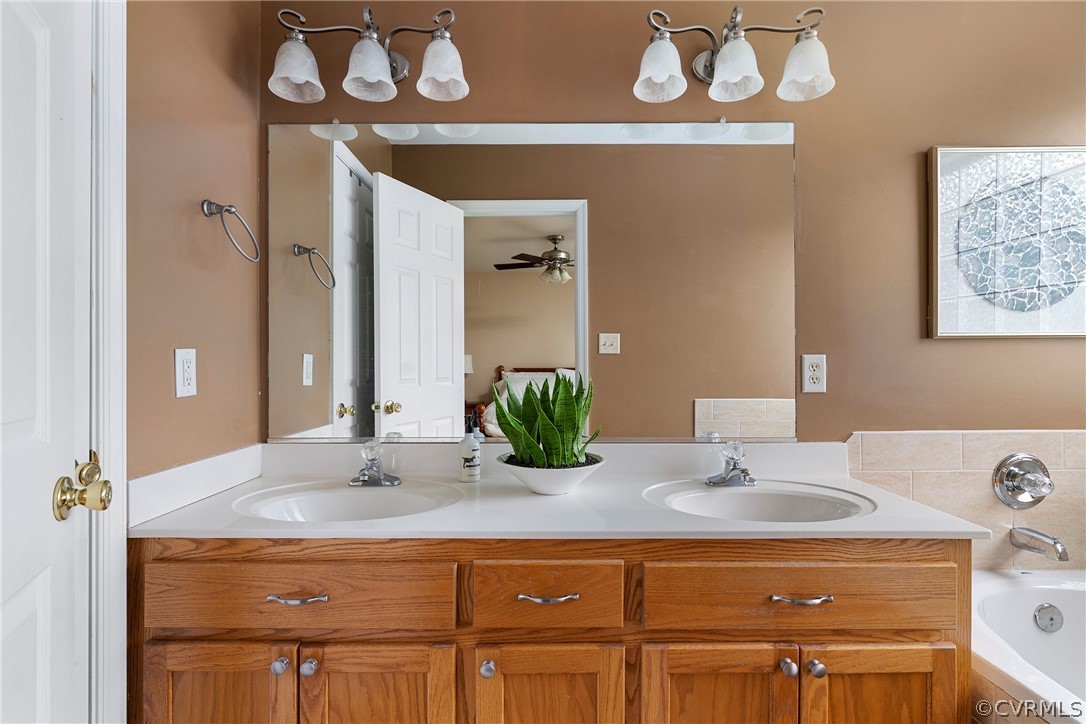 13514 Old Stage Road Hopewell, VA 23860 - Photo 25 of 42 a bathroom with a sink and a mirror