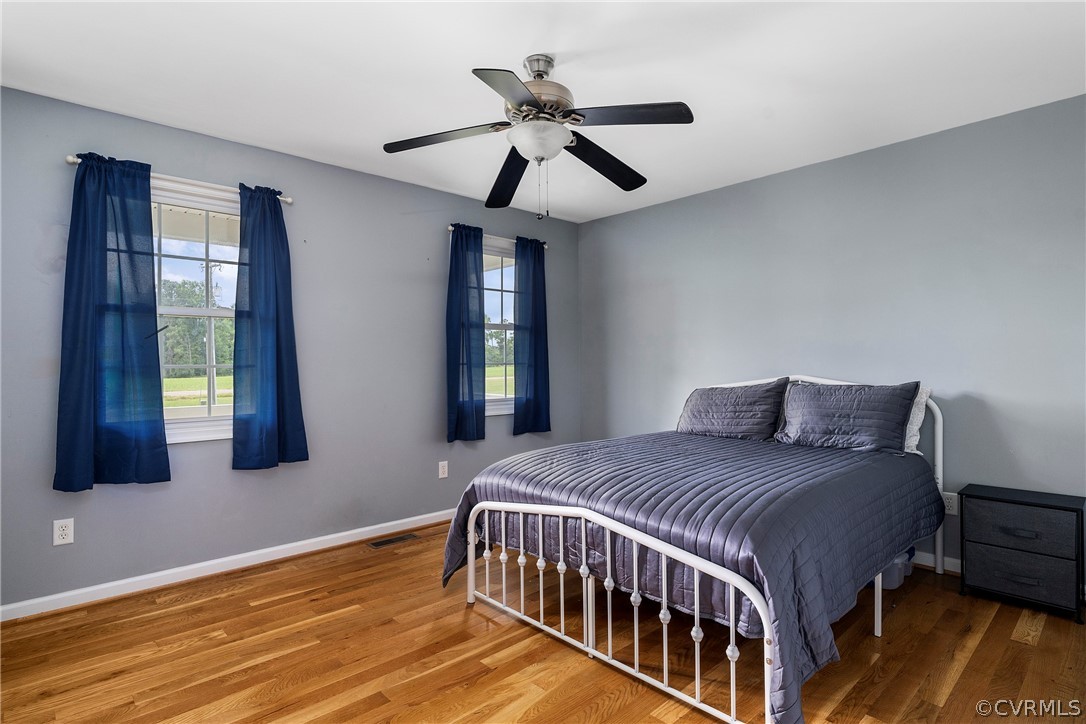13514 Old Stage Road Hopewell, VA 23860 - Photo 27 of 42 a bedroom with a bed and window