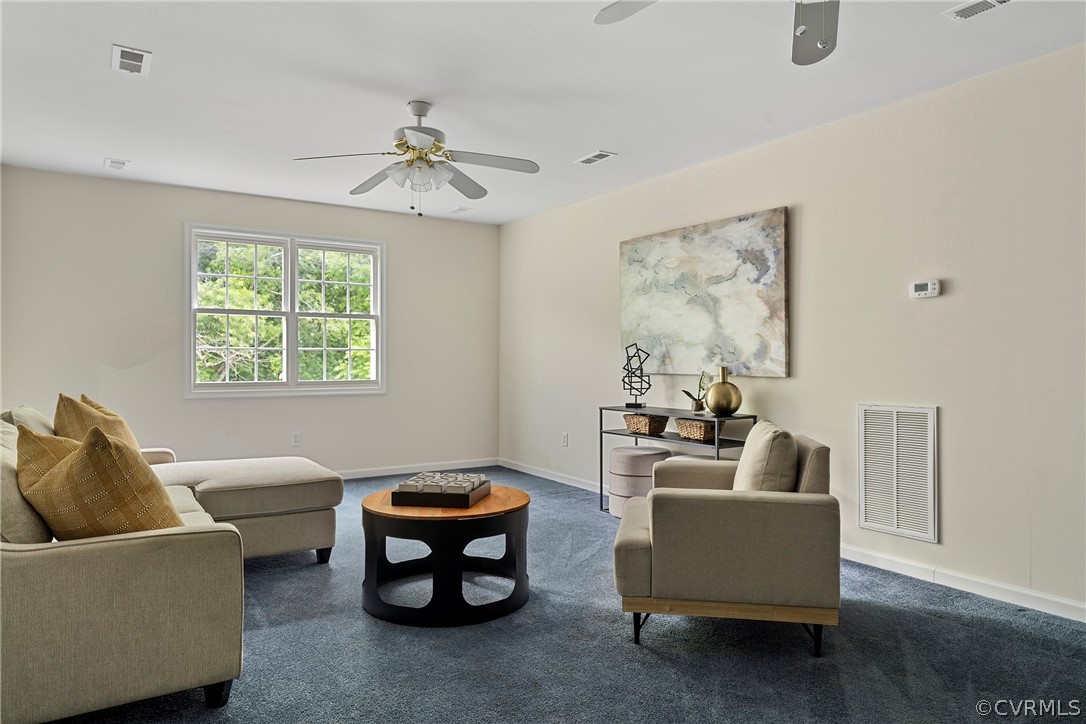 13514 Old Stage Road Hopewell, VA 23860 - Photo 34 of 42 a living room with furniture and a window