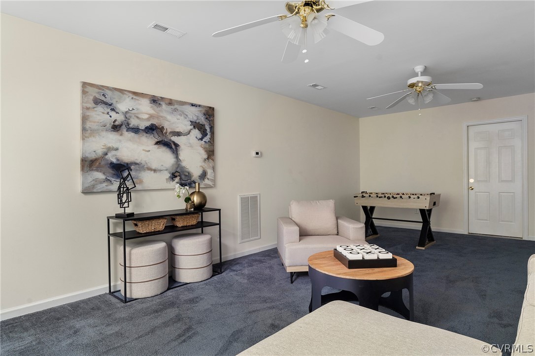 13514 Old Stage Road Hopewell, VA 23860 - Photo 36 of 42 a living room with furniture and a chandelier