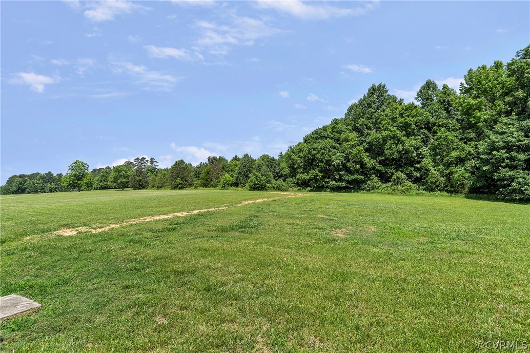 13514 Old Stage Road Hopewell, VA 23860 - Photo 42 of 42 a view of a green field with wooden fence
