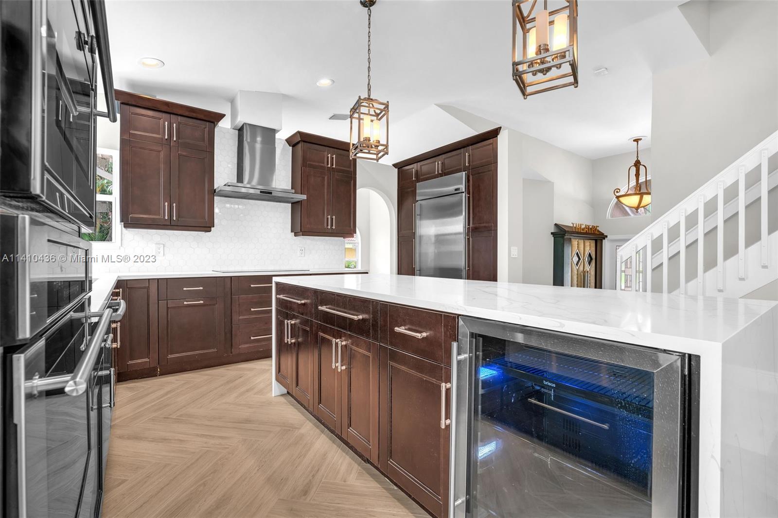 19440 Preserve Drive Boca Raton, FL 33498 - Photo 20 of 69 a kitchen with stainless steel appliances granite countertop a stove a sink and a refrigerator