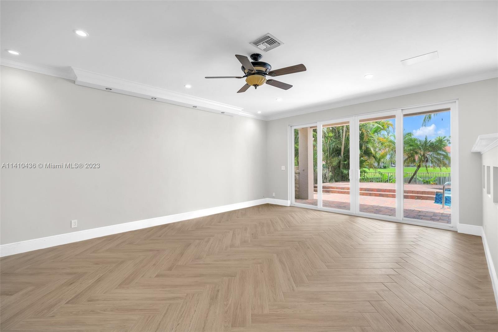 19440 Preserve Drive Boca Raton, FL 33498 - Photo 23 of 69 a view of a livingroom with a ceiling fan and window