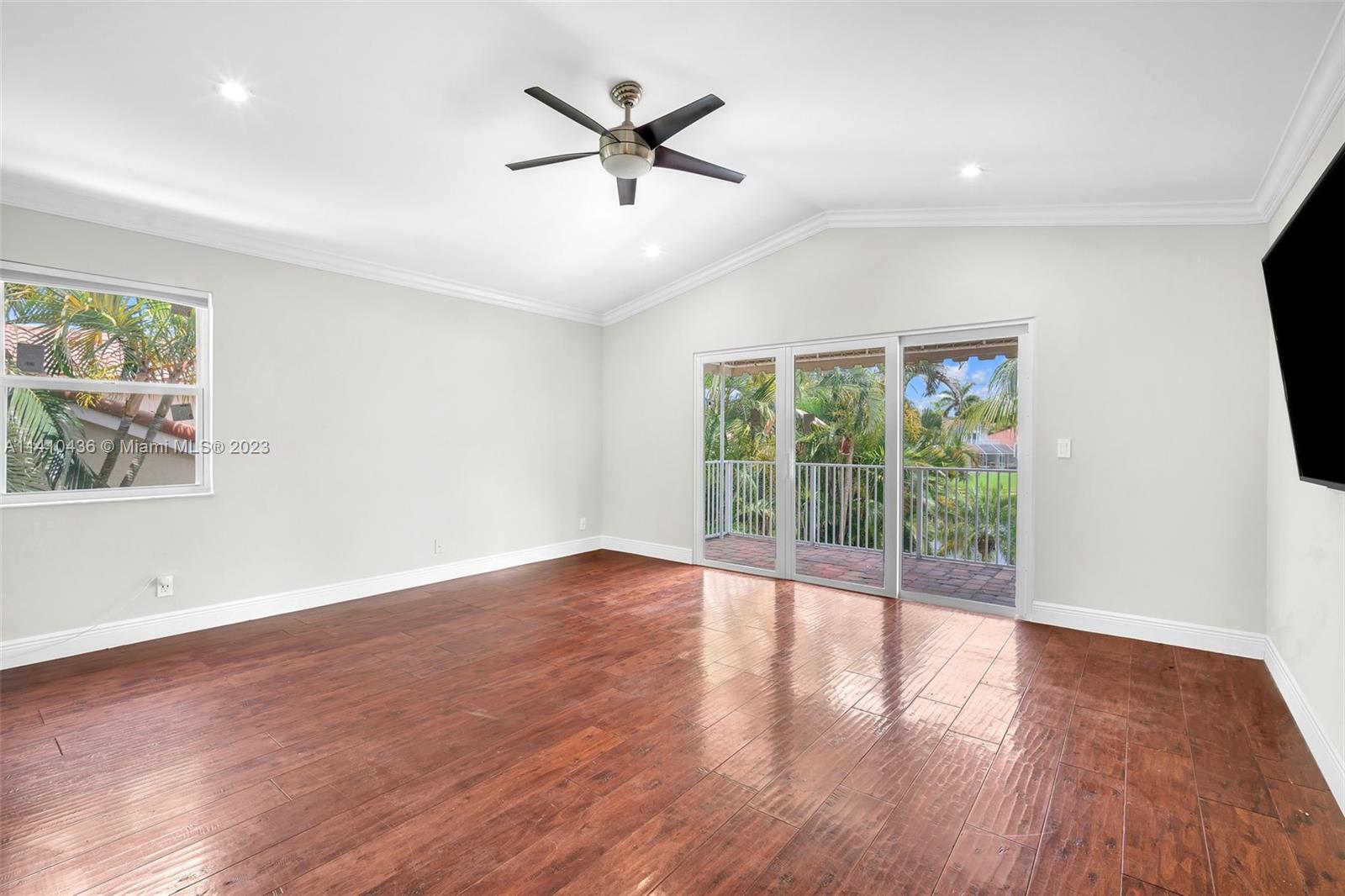 19440 Preserve Drive Boca Raton, FL 33498 - Photo 31 of 69 an empty room with wooden floor and windows