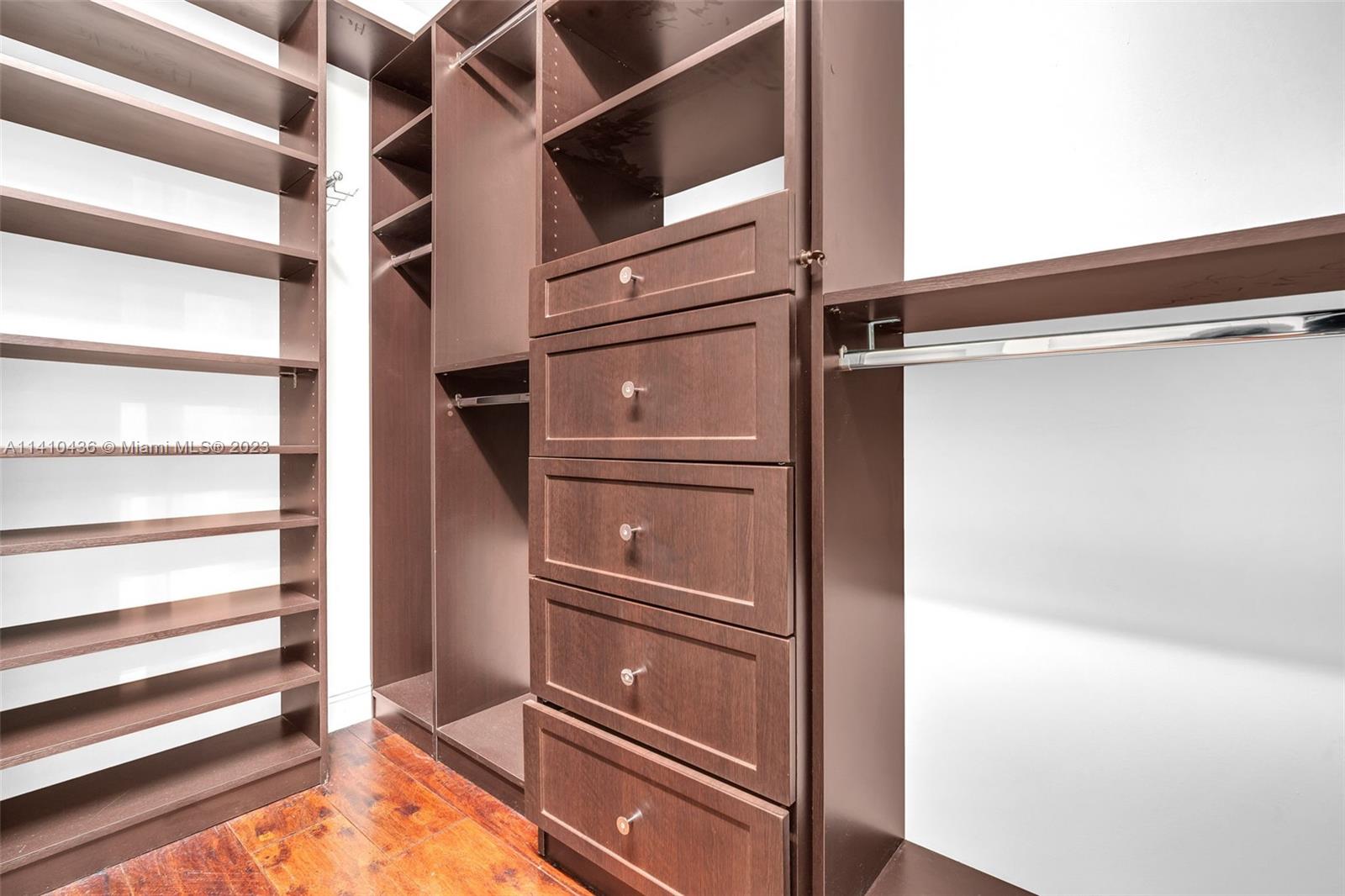 19440 Preserve Drive Boca Raton, FL 33498 - Photo 37 of 69 a view of walk in closet with empty racks