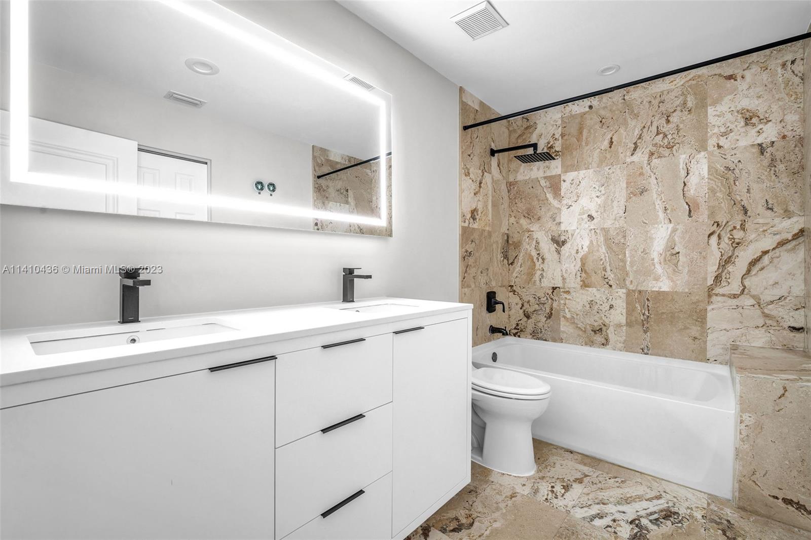 19440 Preserve Drive Boca Raton, FL 33498 - Photo 44 of 69 a view of a bathroom with a sink toilet and shower