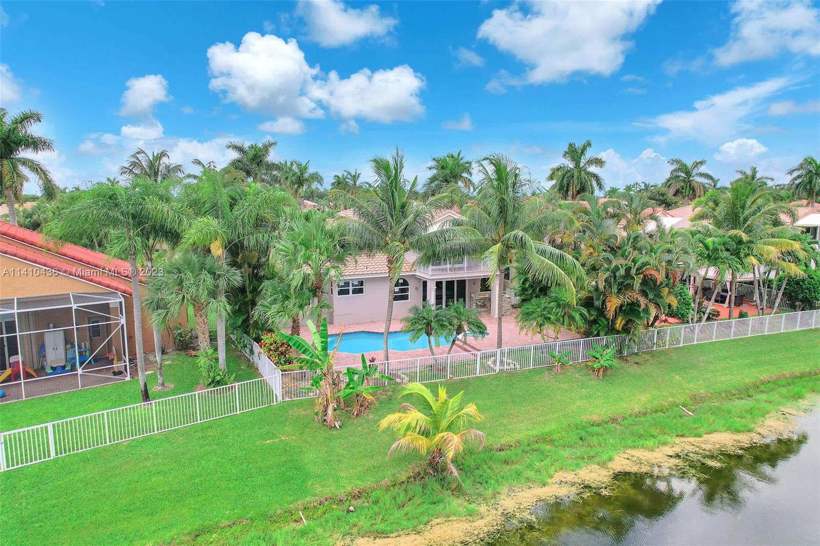 19440 Preserve Drive Boca Raton, FL 33498 - Photo 61 of 69 a view of a house with a backyard and sitting area