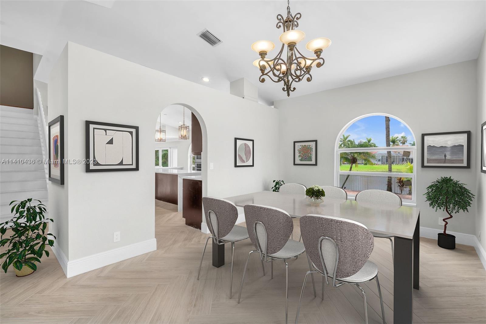 19440 Preserve Drive Boca Raton, FL 33498 - Photo 8 of 69 a view of a dining room with furniture and chandelier