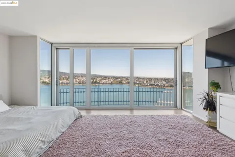 a view of a bedroom with a balcony