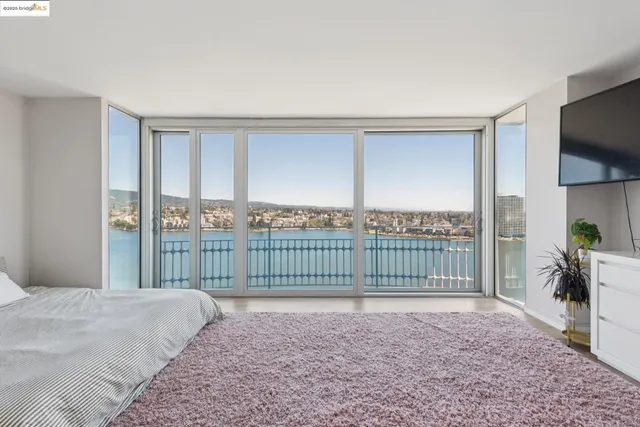 a view of a bedroom with a balcony