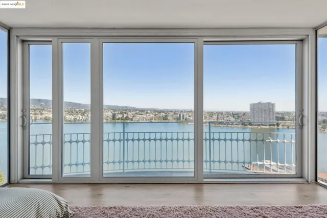 a view of a balcony next to a yard