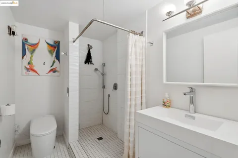 a bathroom with a shower toilet and sink