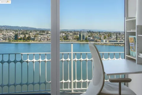 a view of a balcony with chairs