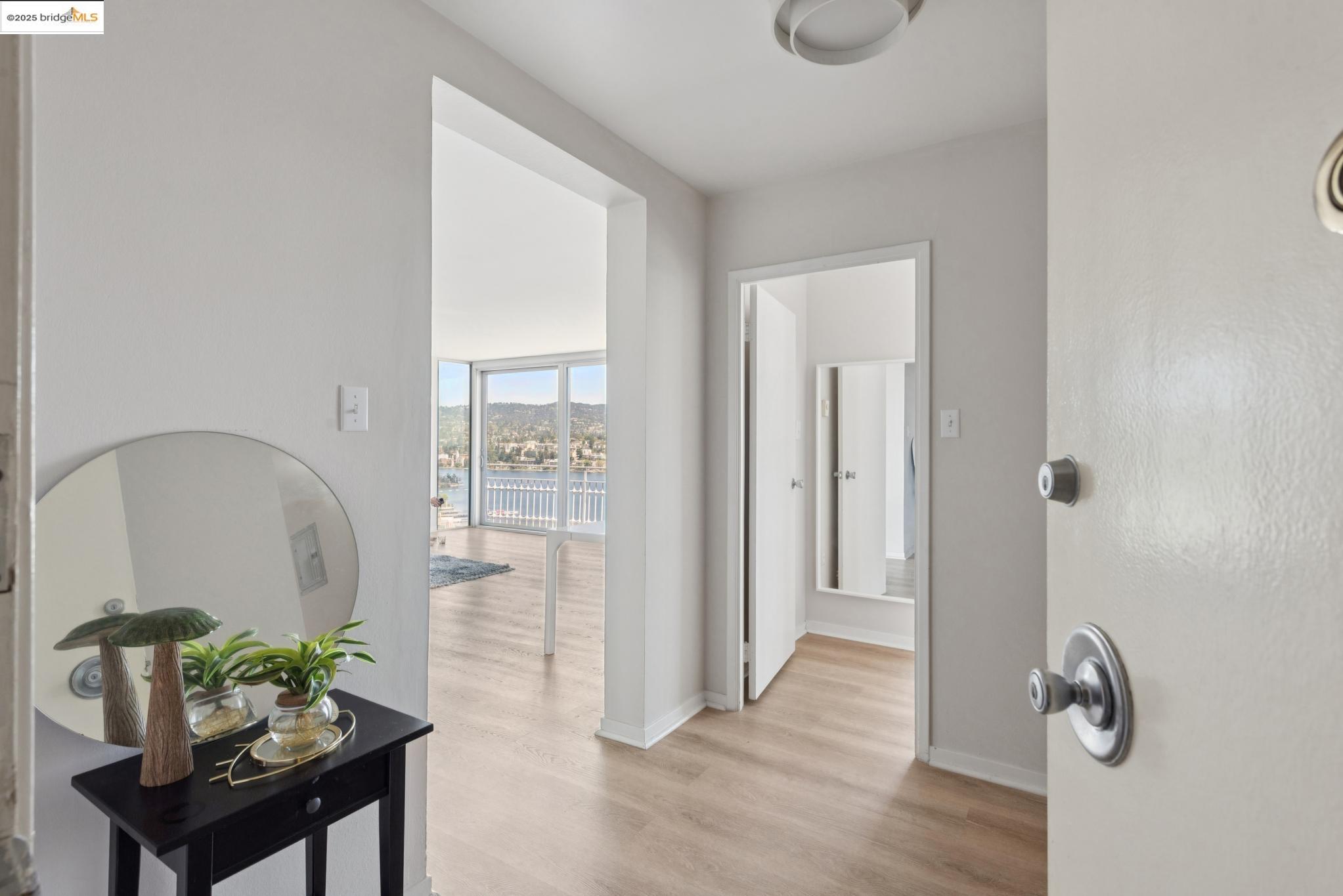 1555 Lakeside Drive, Unit 190 Oakland, CA 94612 - Photo 5 of 45 a living room with furniture and wooden floor