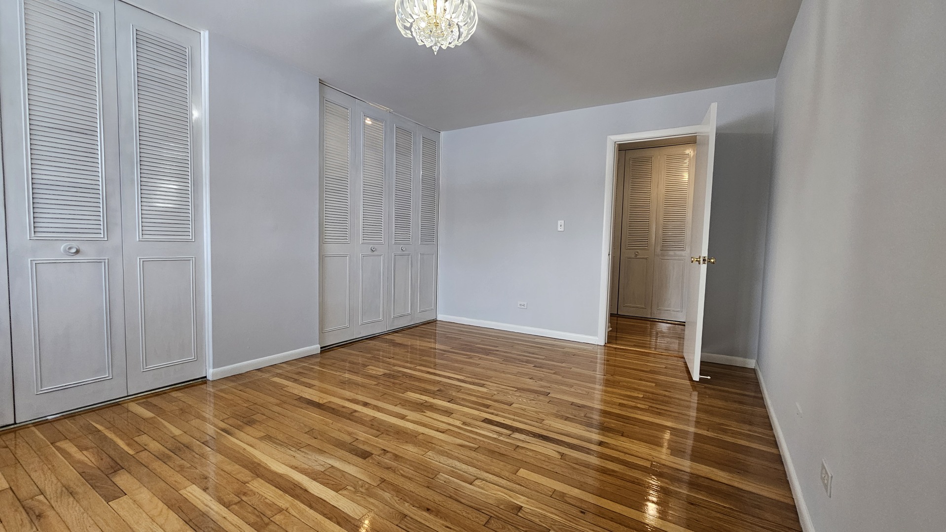 9588 Terrace Place, Unit 1C Des Plaines, IL 60016 - Photo 11 of 13 a view of empty room with wooden floor