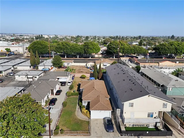 an aerial view of a house with outdoor space and street view