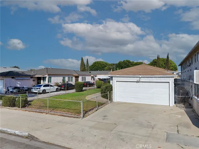 a view of a house with sitting area and a yard